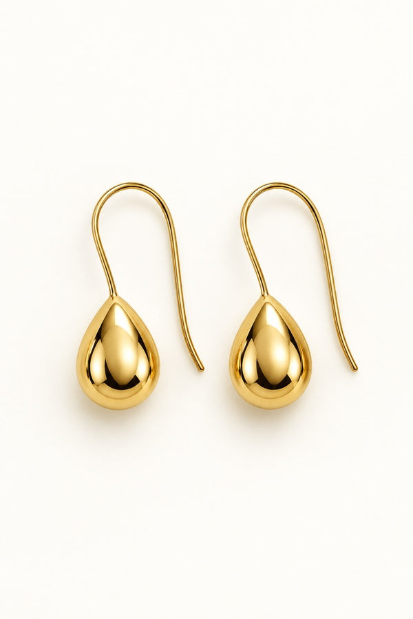Kristy Earrings gold, pair on ivory background