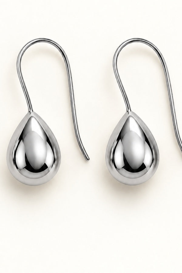 Kristy Earrings silver, close-up on ivory background