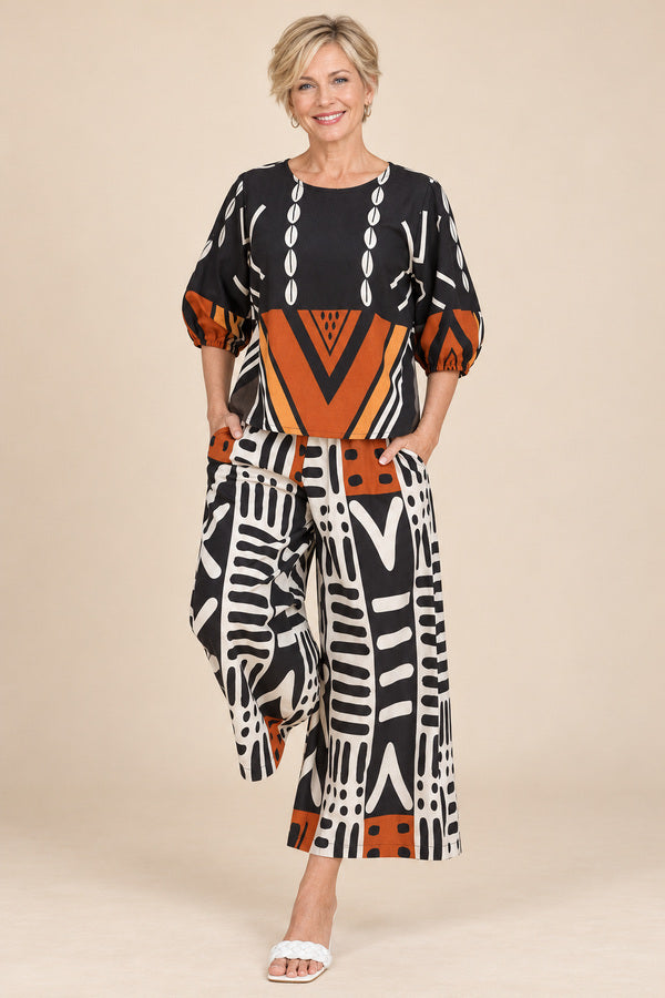Peacock Pants – AI-styled blonde model view 1
